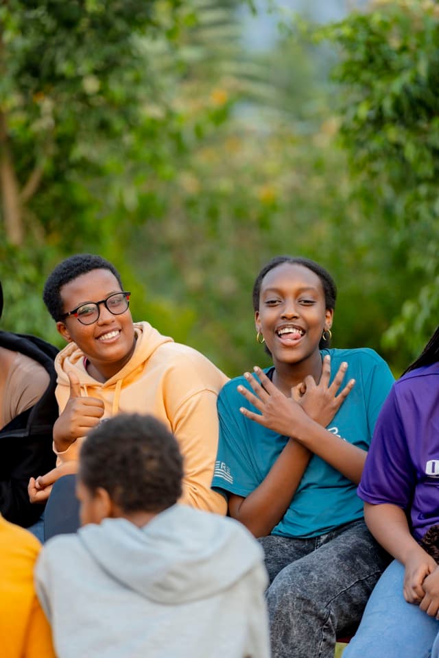 Small group discussion in a circle at camp